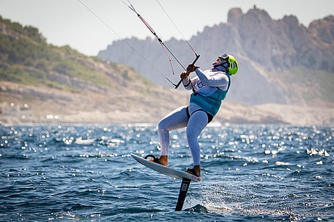 Valentin Bontus, of Austria, screams with joy after winning the gold in men's kite final race